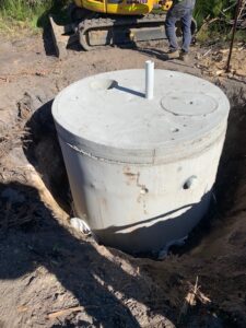 Concrete septic tank installed below ground
